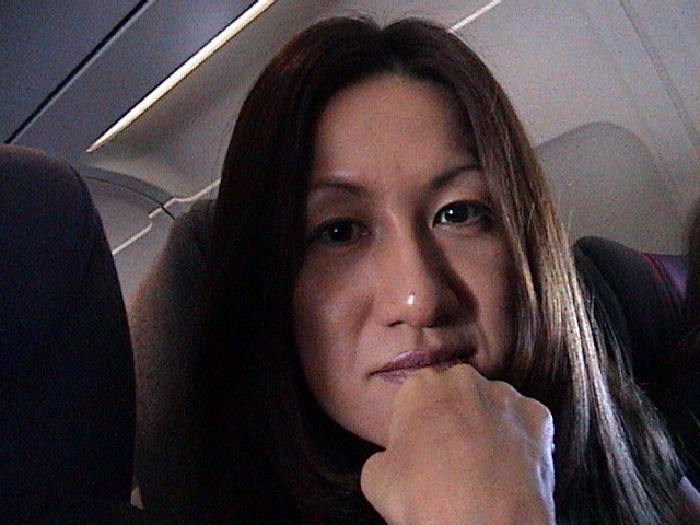 WDW00-02-Setsuko_on_plane_to_Florida.jpg
