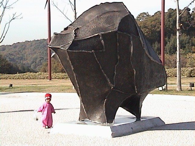 Japan00-007-alien_bison_sculpture_about_to_eat_little_girl.jpg